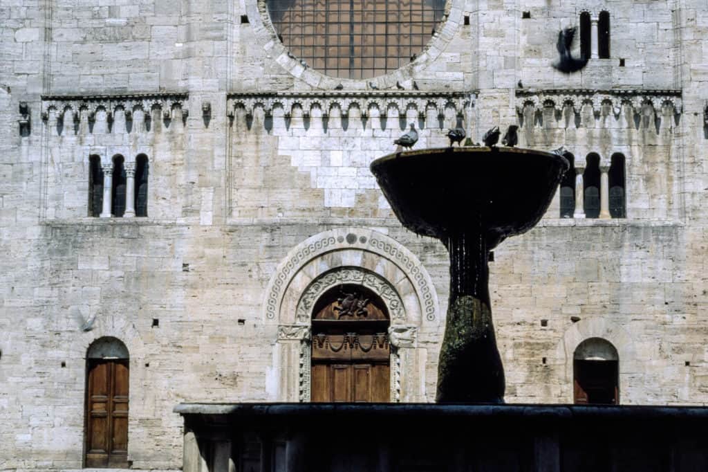 Umbria's spectacular small towns. Pigeons on a fountain in Bevagna.